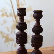 Pair of turned and carved wooden candlesticks