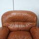 2 fauteuils en cuir cognac, années 1970
