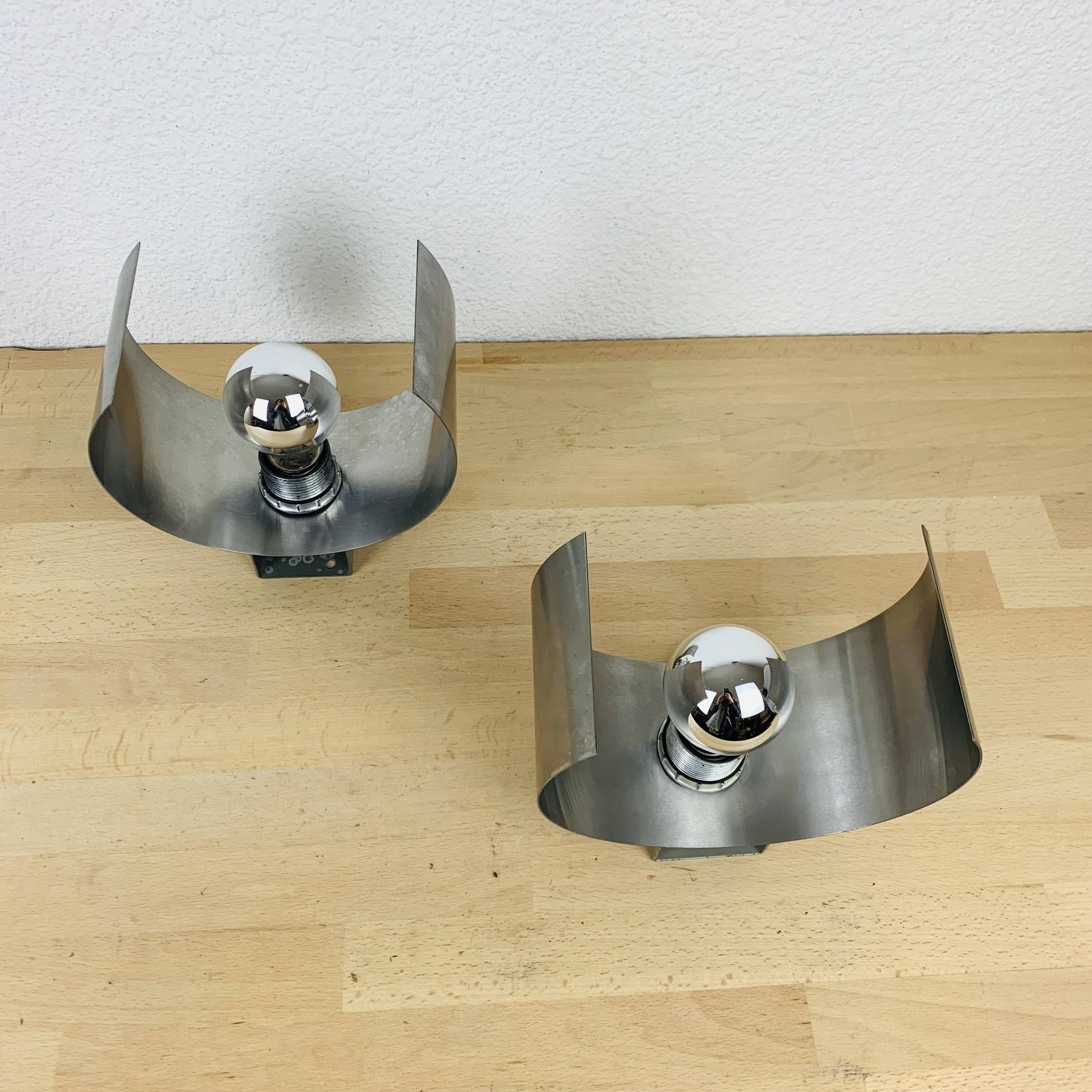 Pair of 70's brushed aluminum space age wall lights