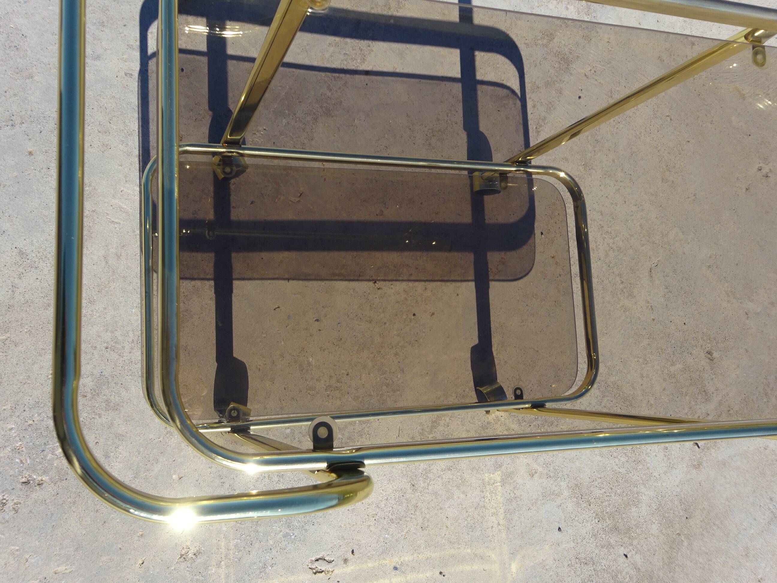 Golden metal and smoked glass dessert table