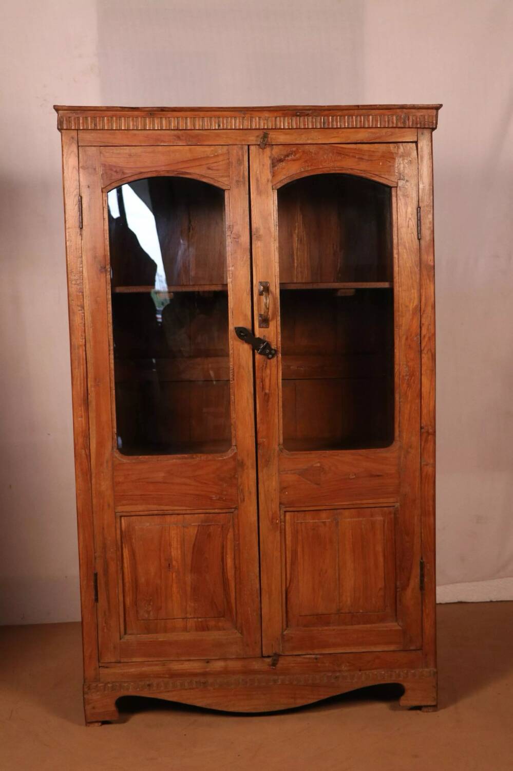 Antique Art Deco display cabinet in Burmese teak.