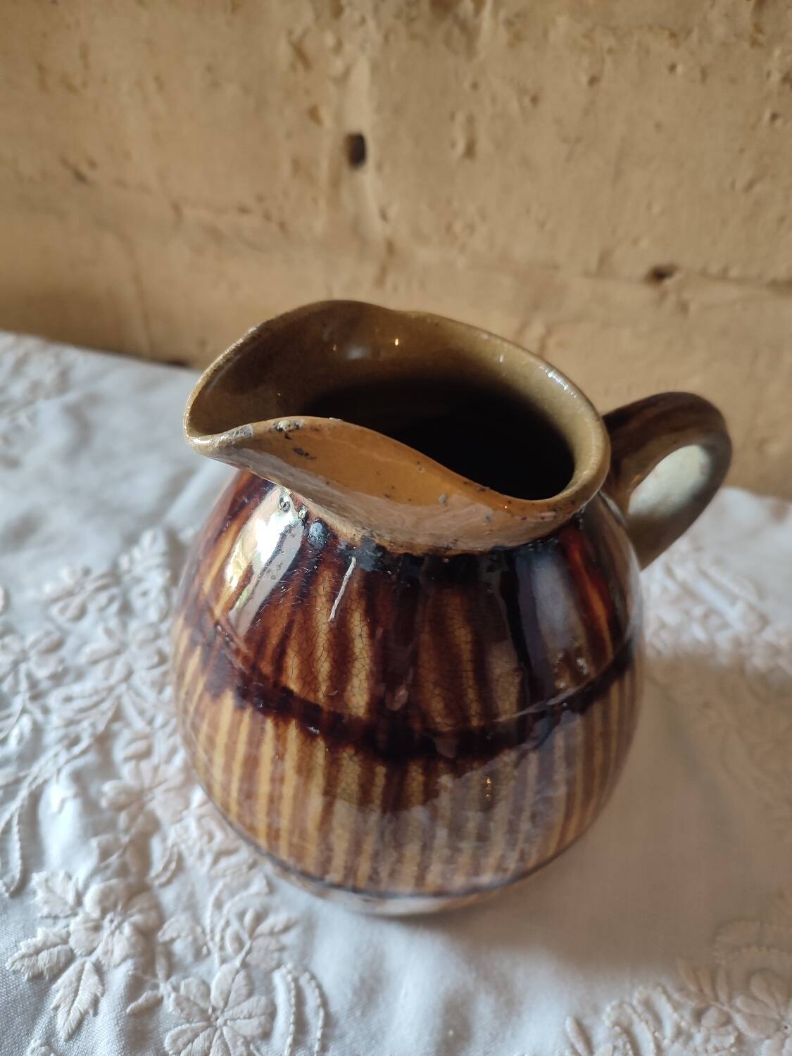 Old sandstone pitcher vase