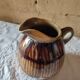 Old sandstone pitcher vase