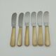 Twelve vintage butter knives