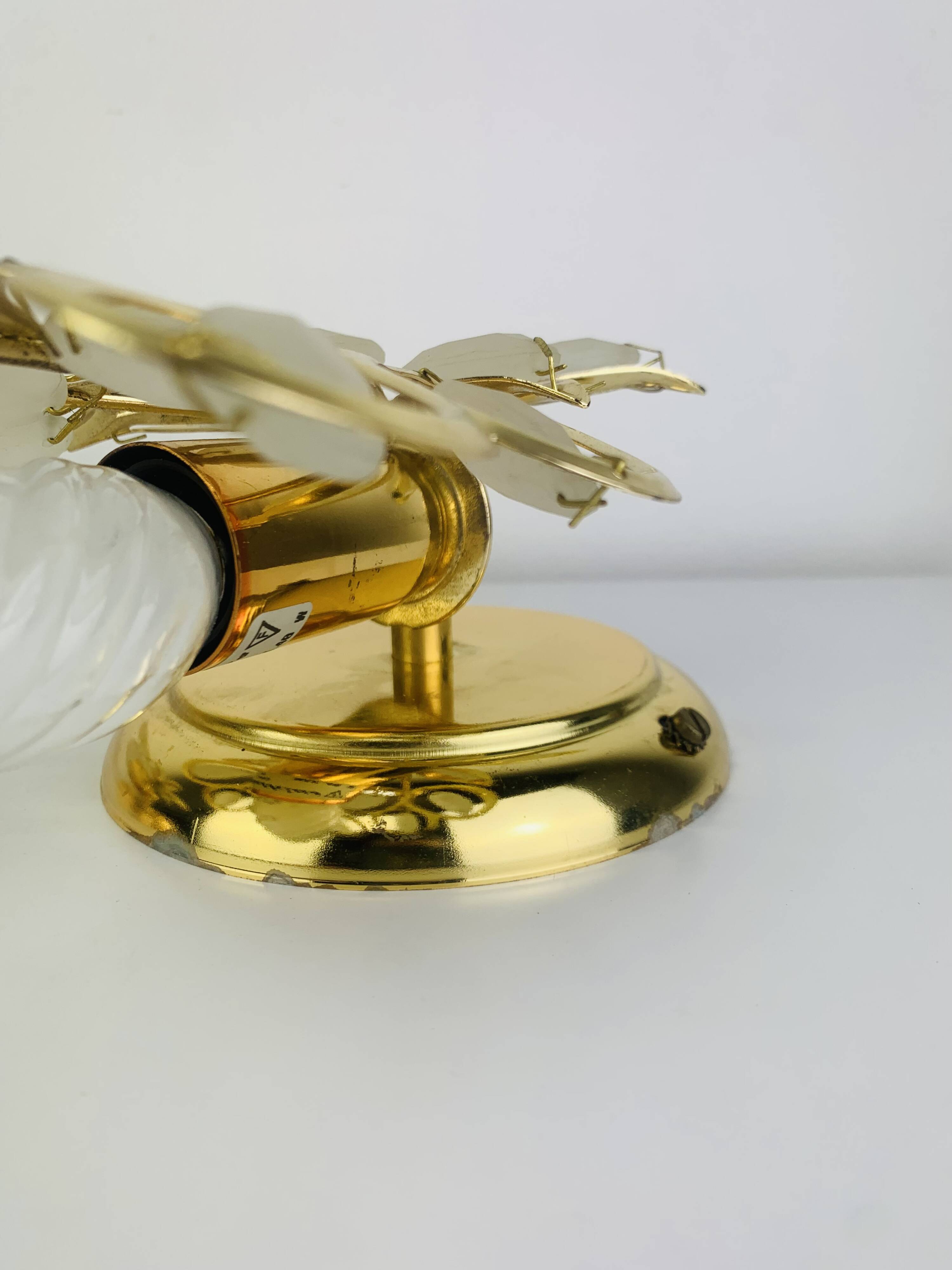Pair of Hollywood Regency wall lights with glass and gold metal pendants Mathias