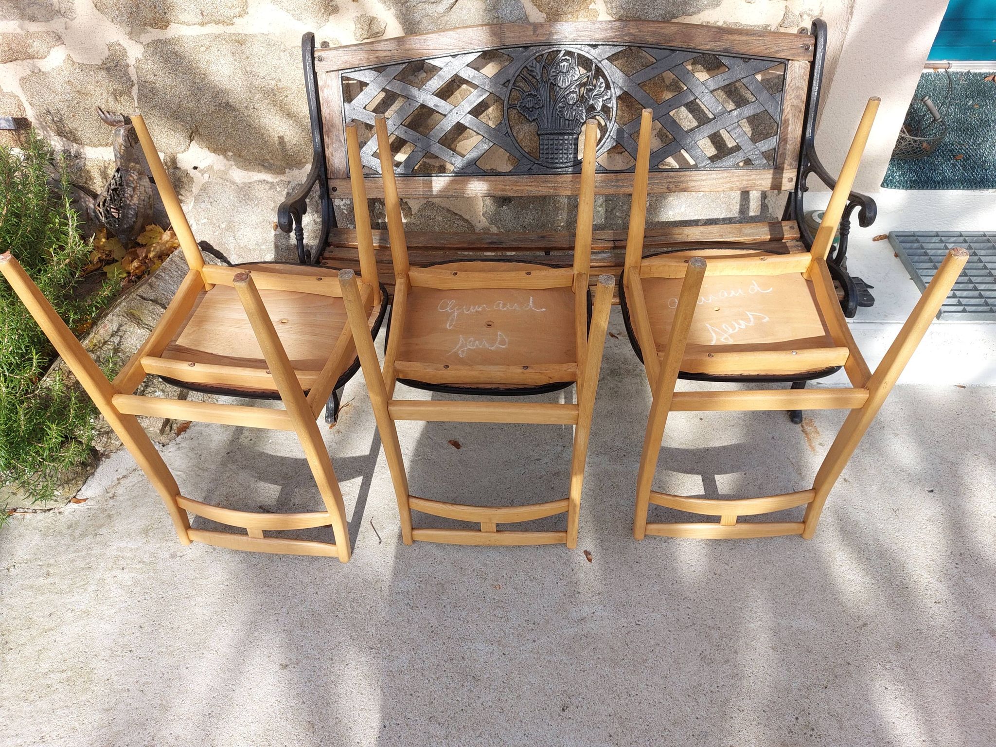 3 Scandinavian style chairs, light wood and black faux leather.