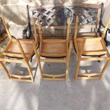 3 Scandinavian-style chairs, light wood and black faux leather