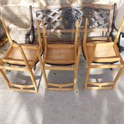 3 Scandinavian style chairs, light wood and black faux leather.