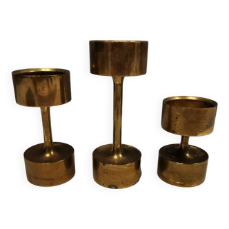 Three beautiful candle holders in solid brass, for block candles. Denmark 1960s