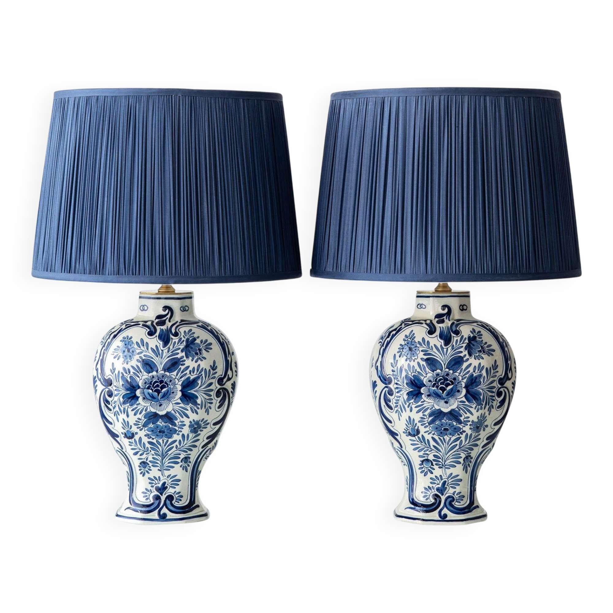 Pair of Royal Delft blue and white ceramic table lamps, 1905, with new pleated silk shades.