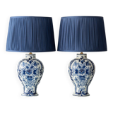 Pair of Royal Delft blue and white ceramic table lamps, 1905, with new pleated silk shades.