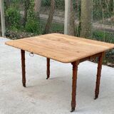Louis Philippe 19th century square table with shutters in solid oak wood on casters