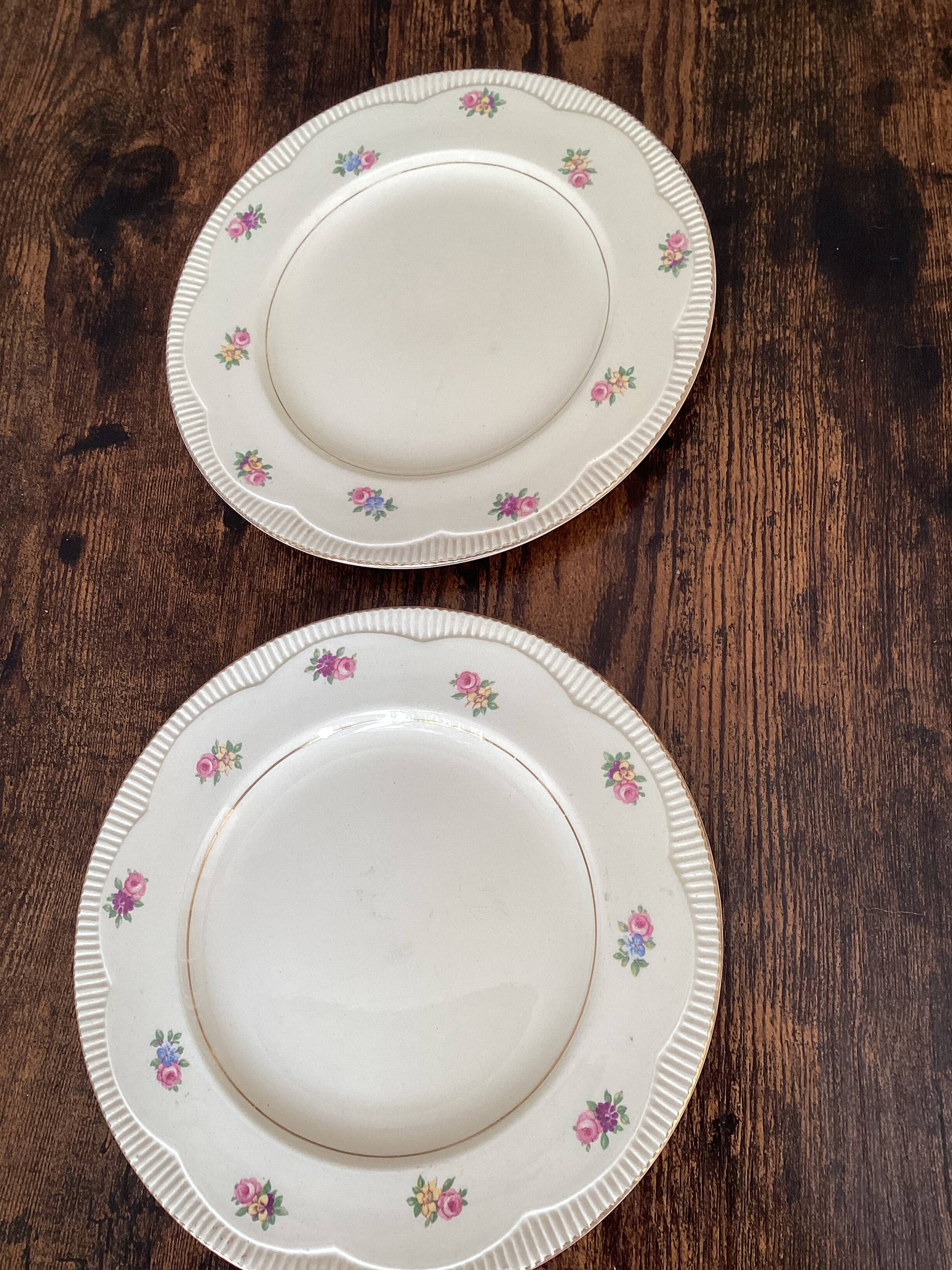 Two identical vintage Clarice Cliff plates from the Newport Pottery.