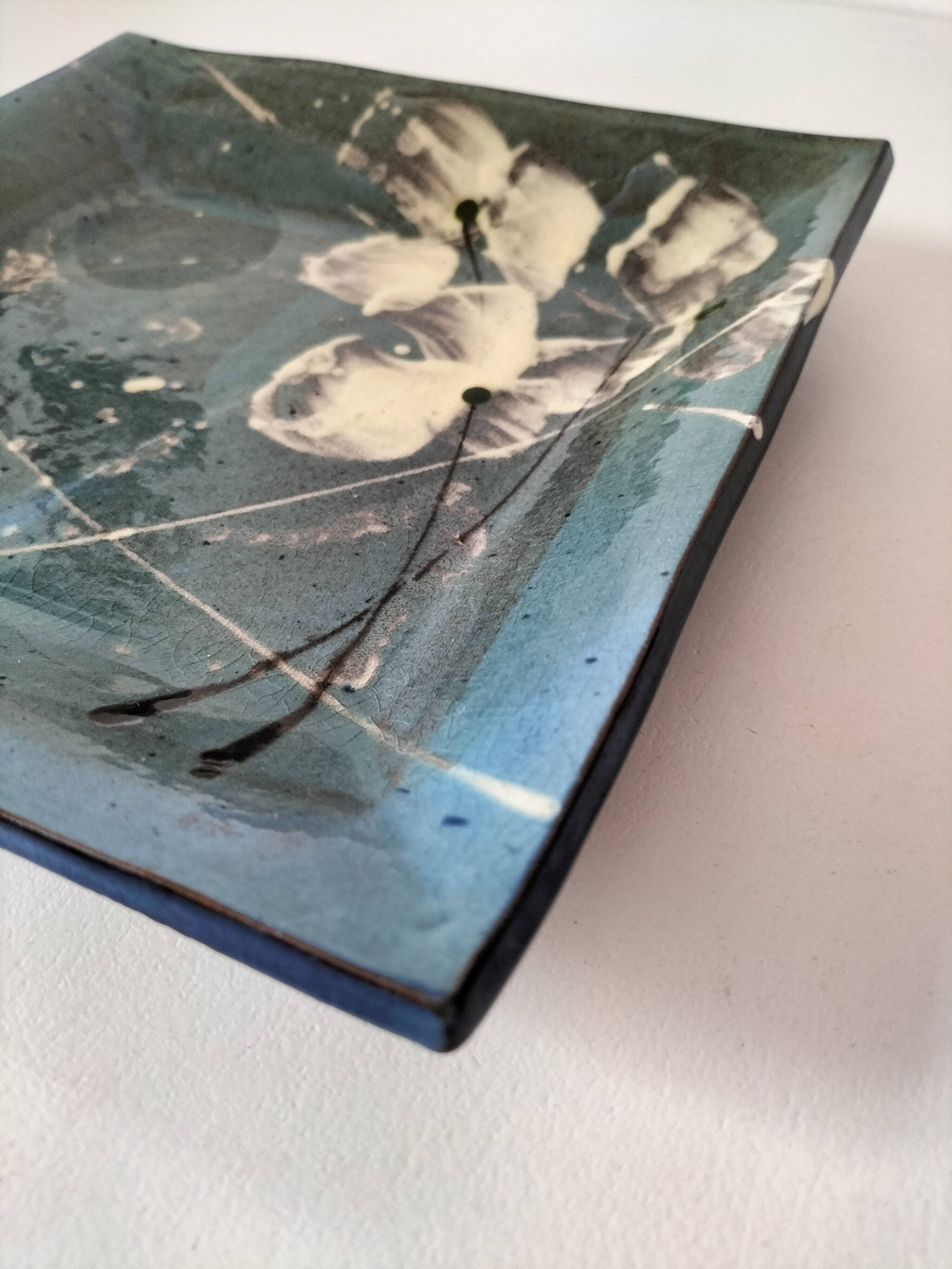 Square turquoise glazed stoneware dish, abstract floral decoration, signed.