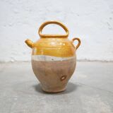 Old gargoulette pot in glazed terracotta