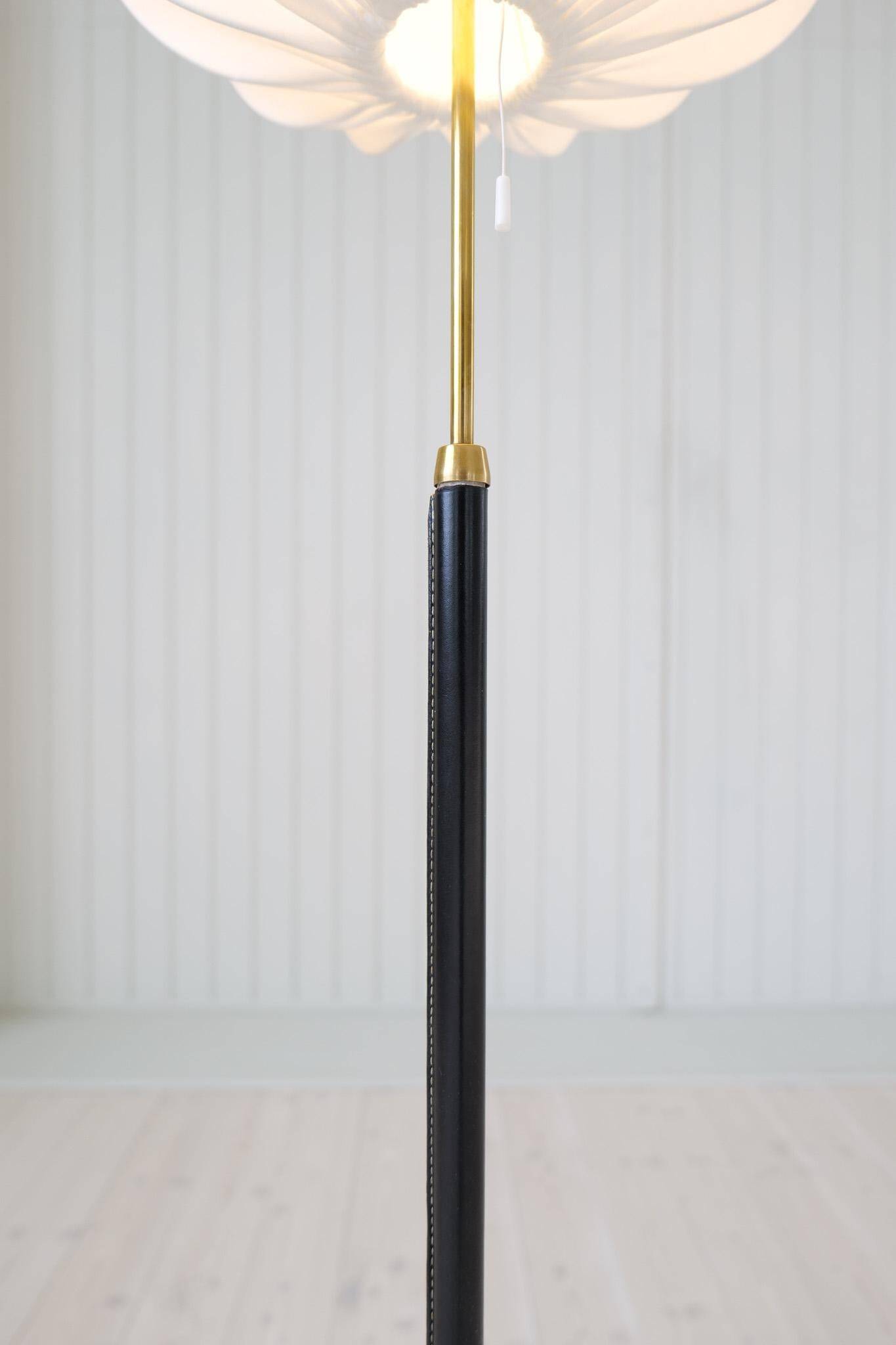 Mid-century black leather floor lamp by Falkenbergs Belysning, Sweden, 1960s.