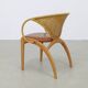 Pair of leather and rattan chairs by Lübke