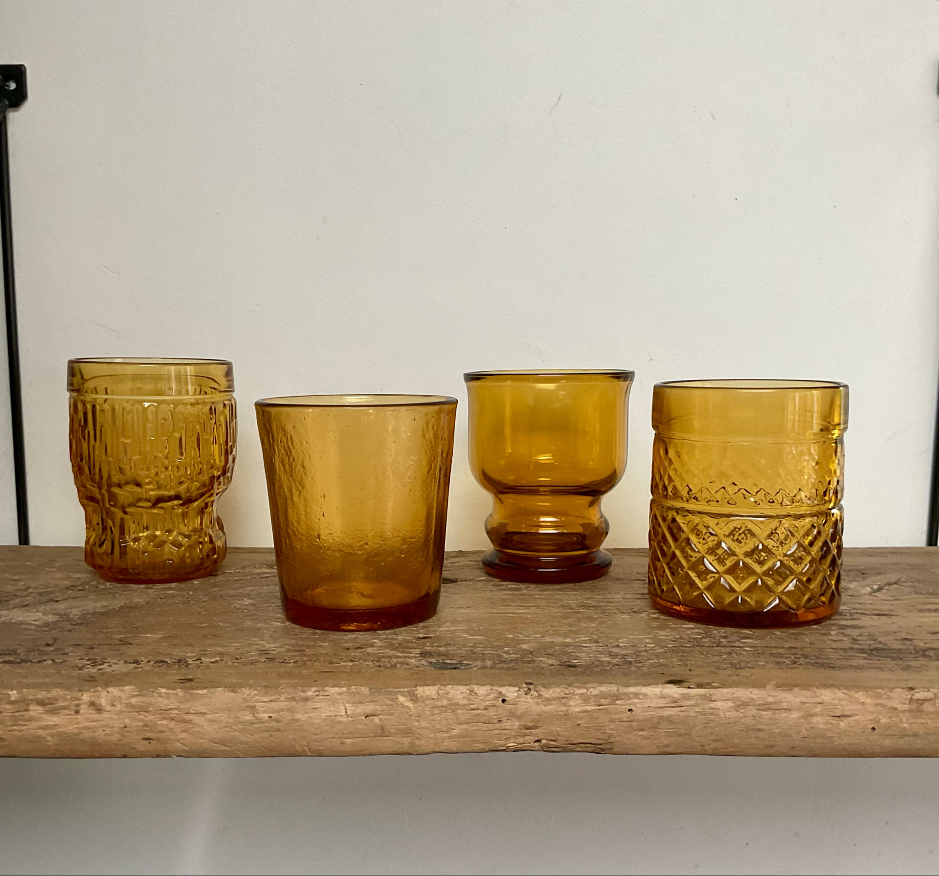 4 mismatched amber glasses
