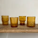 4 mismatched amber glasses