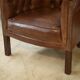 Paire de fauteuils Club capitonnés en cuir