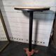 Bistro standing table with marble top and cast iron base.
