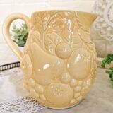 Vintage yellow pitcher in fruit slip