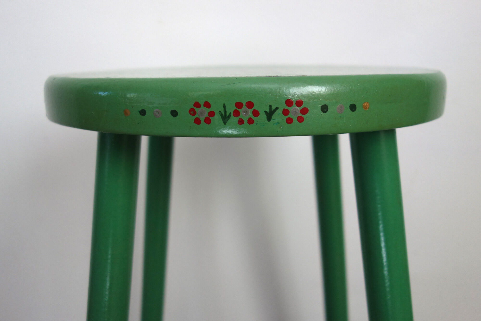 Old painted and decorated wooden stool