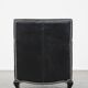 Armchair in black grained cowhide leather with a deep seat