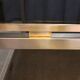 Table basse Guy Lefevre en acier et bronze