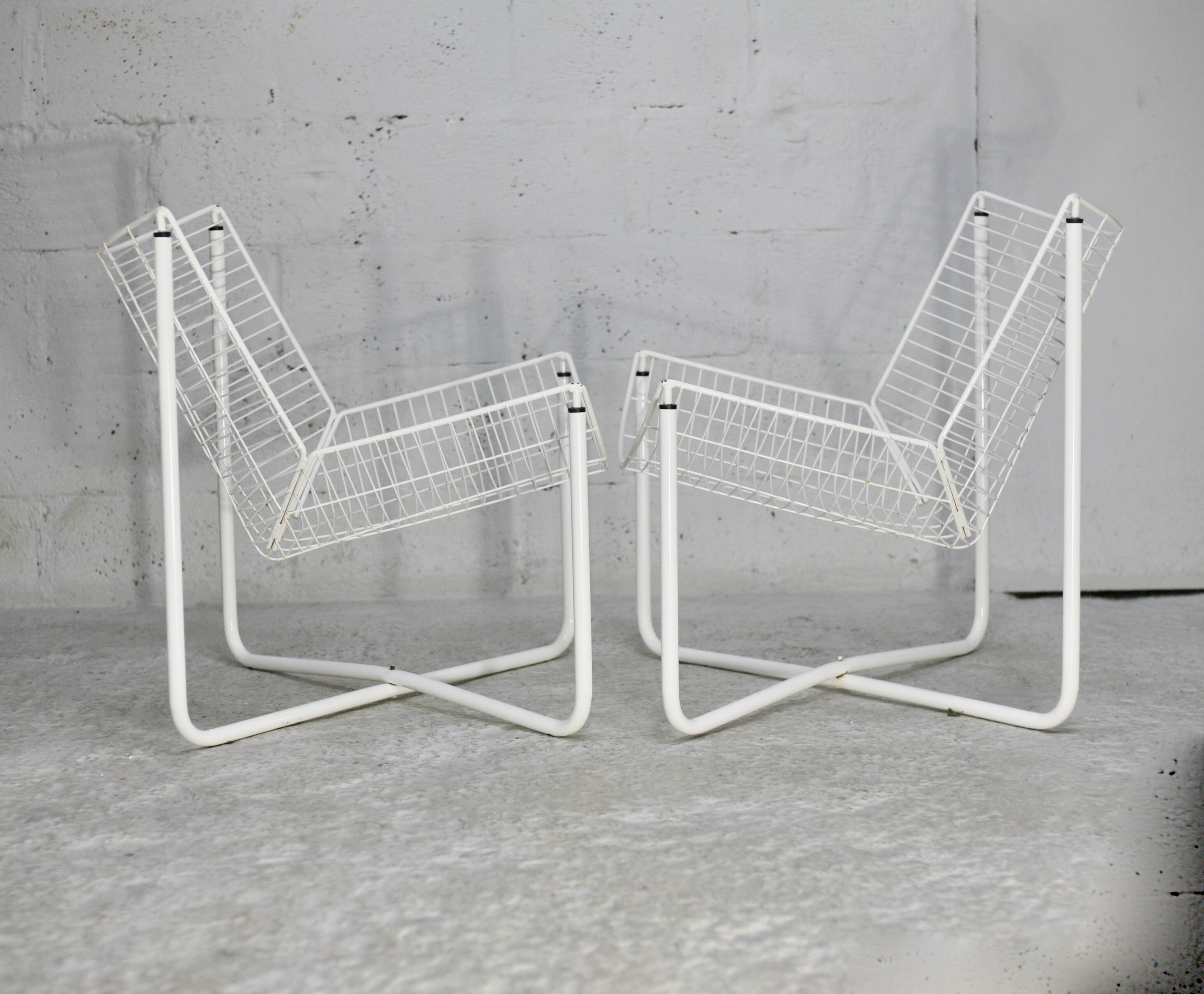 Pair of white lacquered steel rod armchairs. Circa 1985