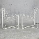 Paire de fauteuils tiges d'acier laqués blanc. Circa 1985