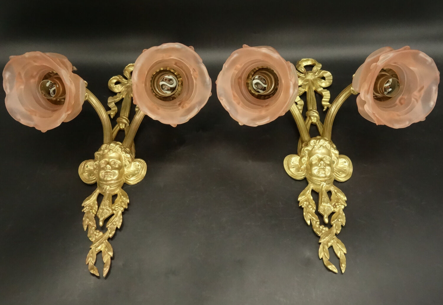 Pair of sconces with the heads of Zephyr Louis XVI style