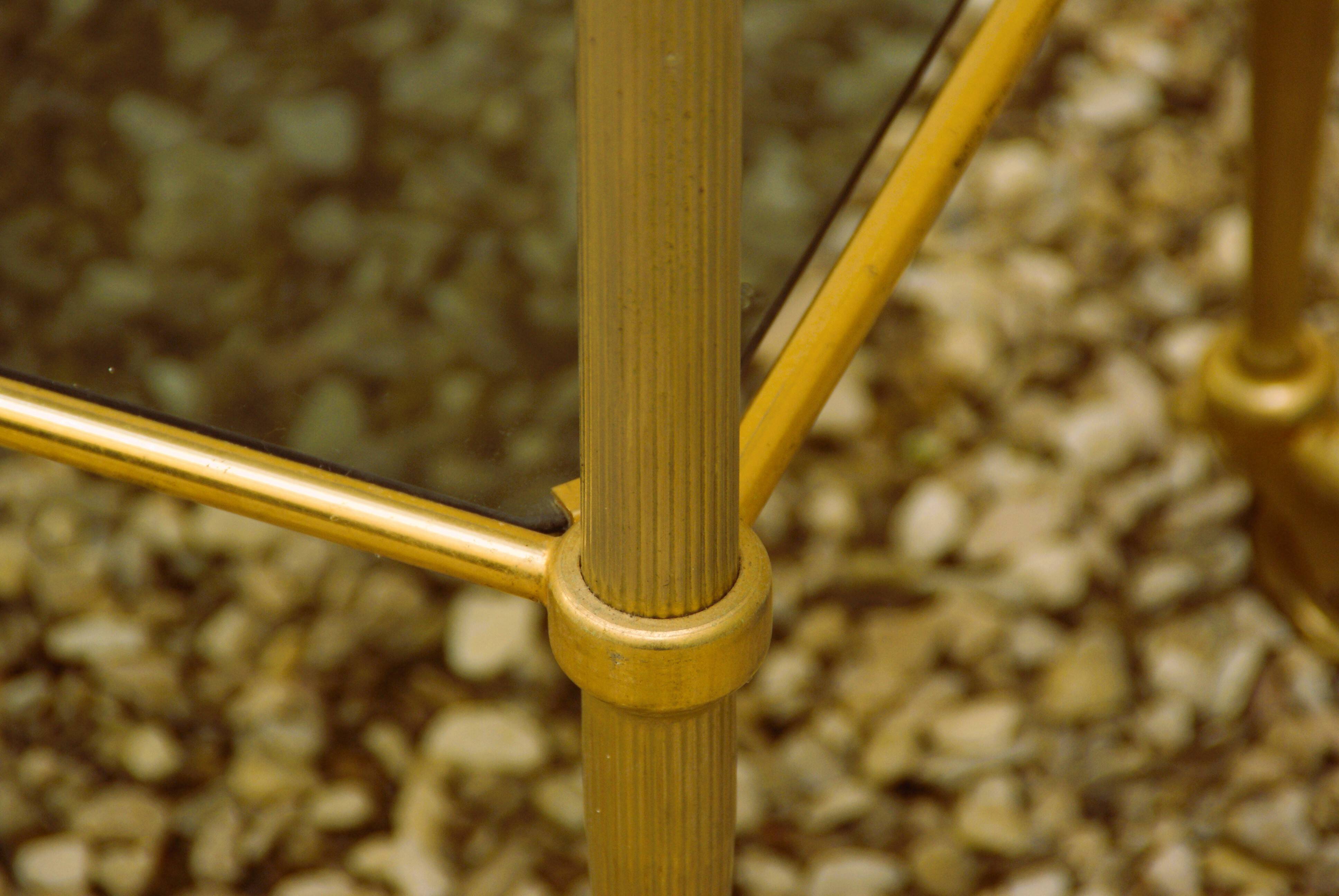 Antique brass serving trolley with smoked glass top, Louis XVI style.