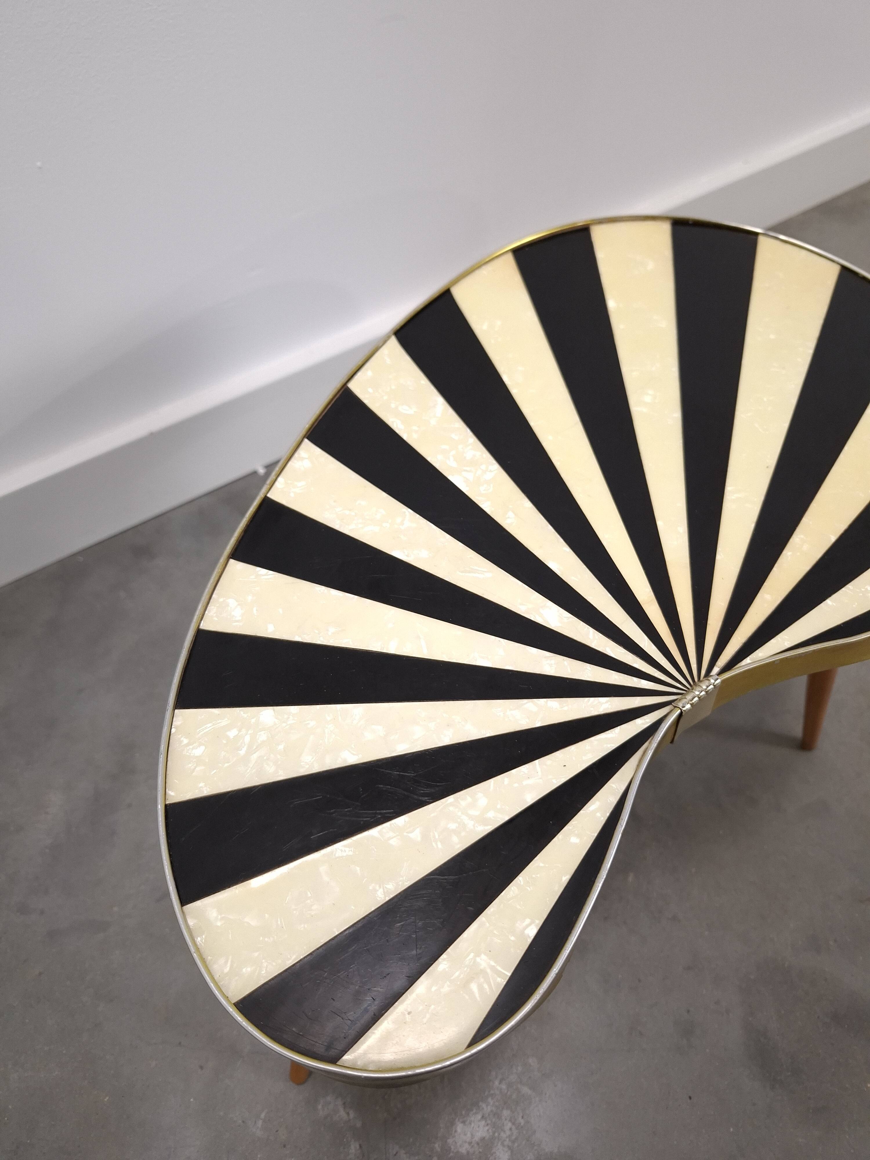 1950s kidney-shaped black and white table, plant table.