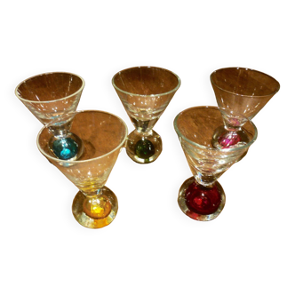 5 small glasses with colored bubble inclusions