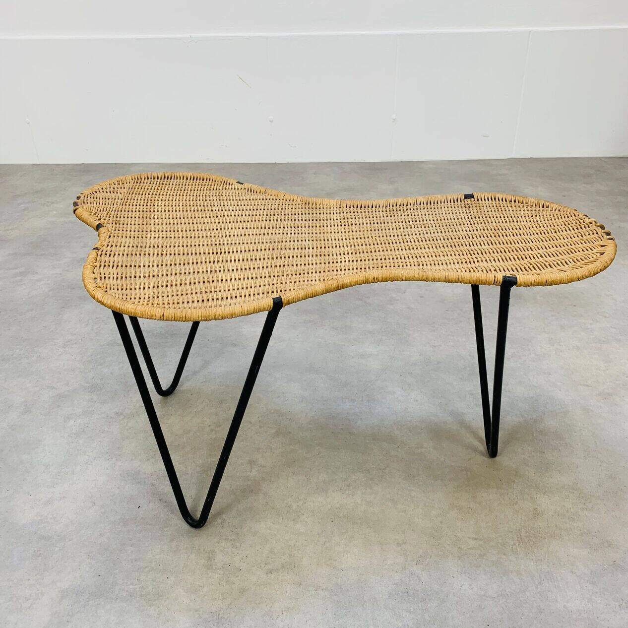 Raoul Guys coffee table, free form, wicker and metal, 1960s.