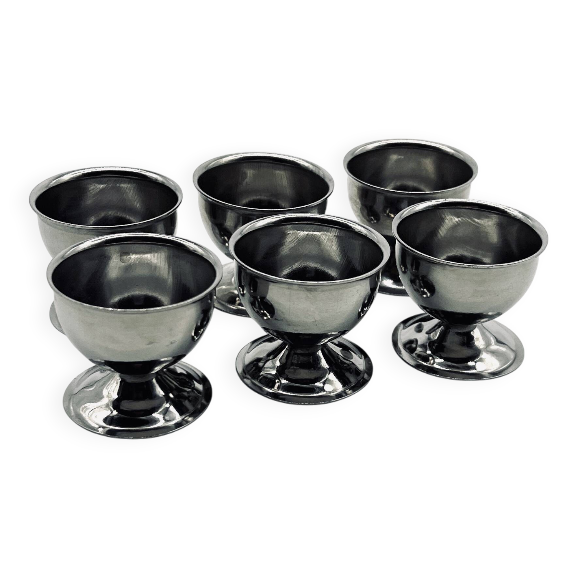Six stainless steel egg cups