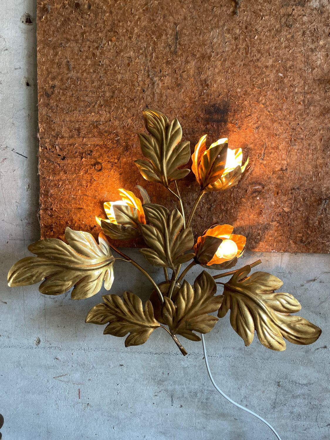 Golden wall lamp foliage