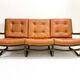 Mid-century modern rattan and cognac leather sofa