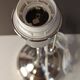 Modern white nickel lamp base with pull switch.