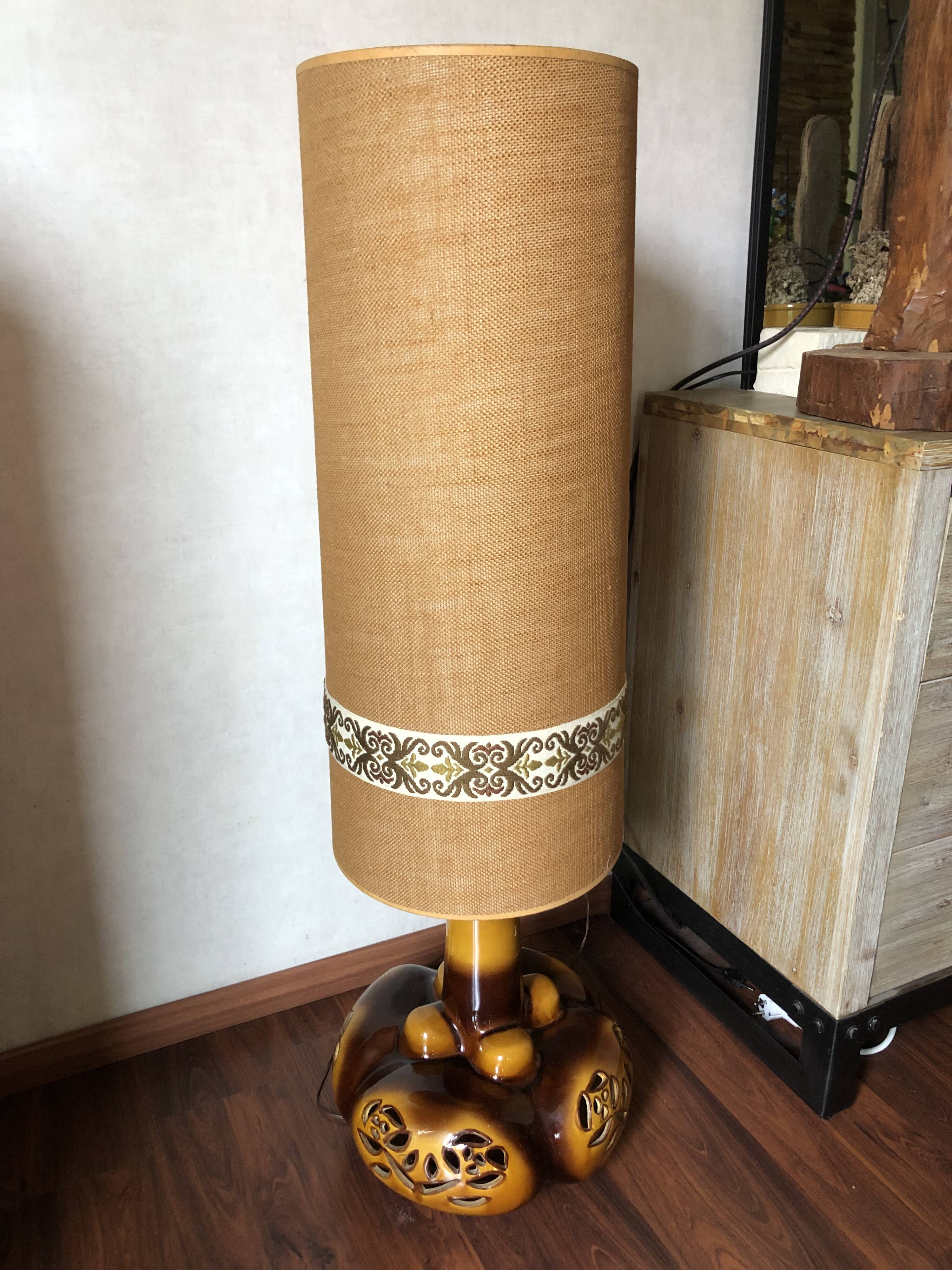 Large vintage ceramic table lamp with rose pattern.