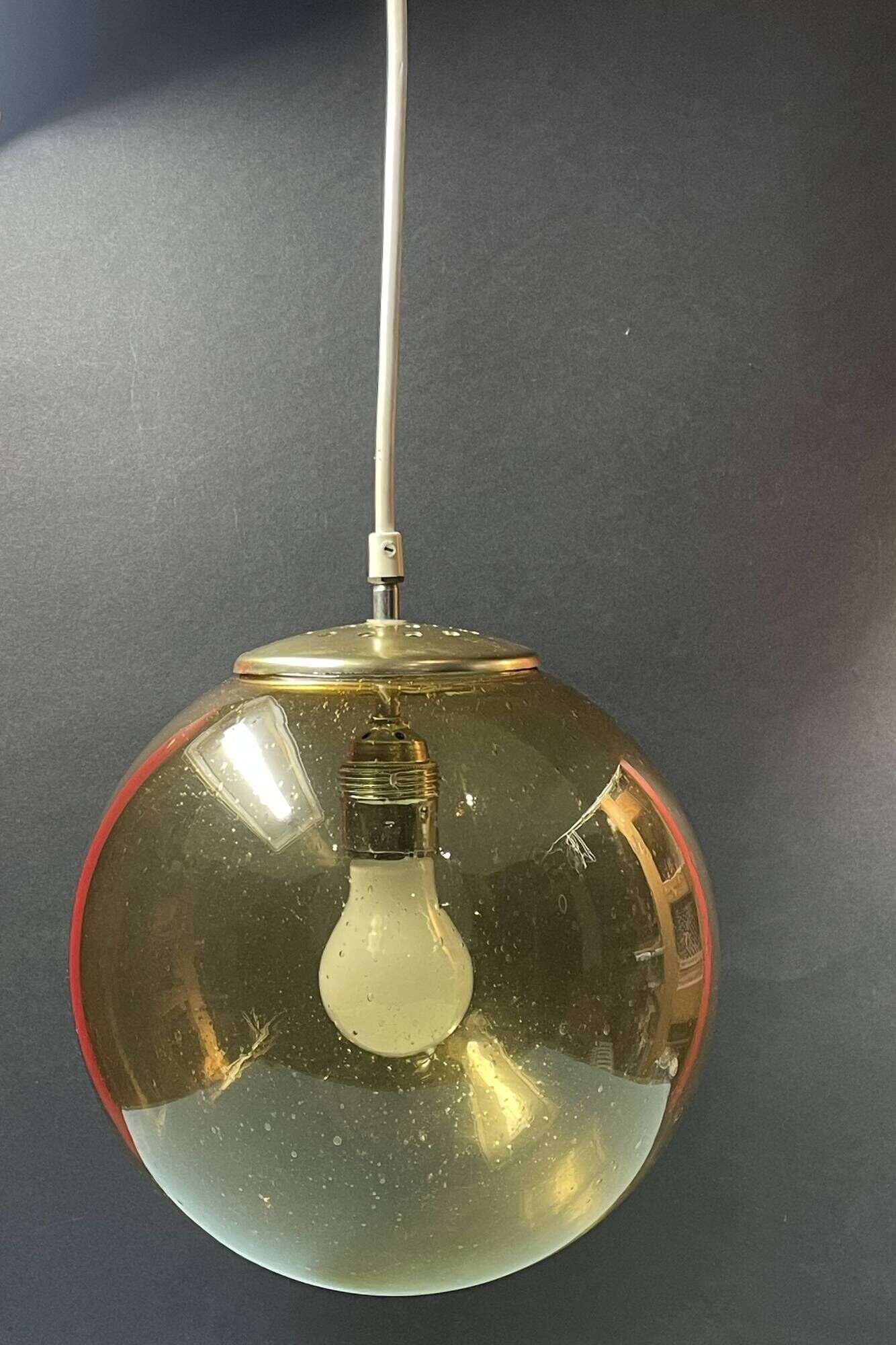 Pair of vintage smoked glass ball pendant lights from Biot glassworks