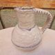 Old stamped glazed terracotta jug
