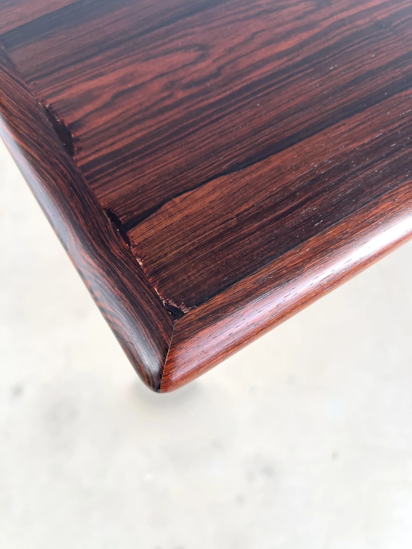 Rosewood dining table with integrated extensions — Denmark, 1960s