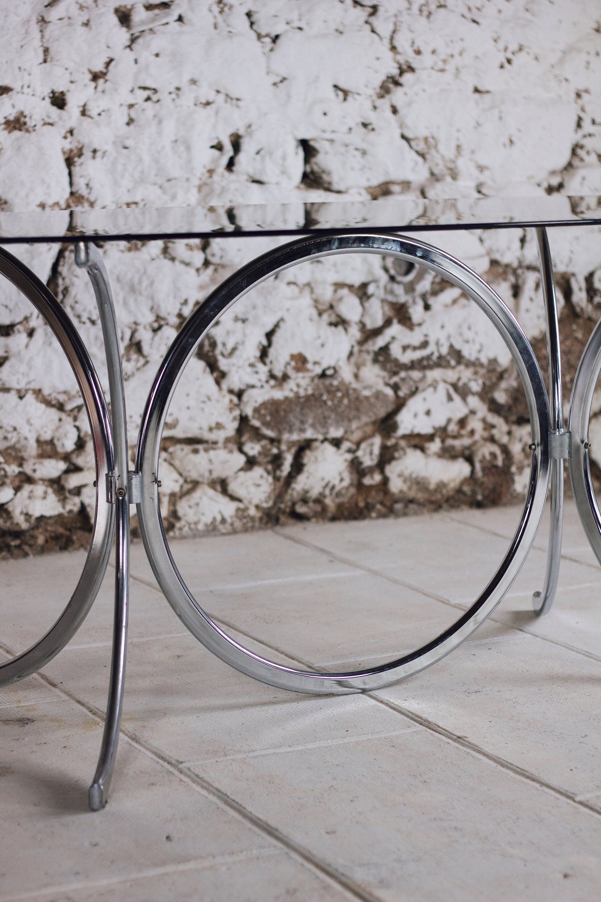 Chrome and smoked glass dining table in the style of Gastone Rinaldi, 1970.