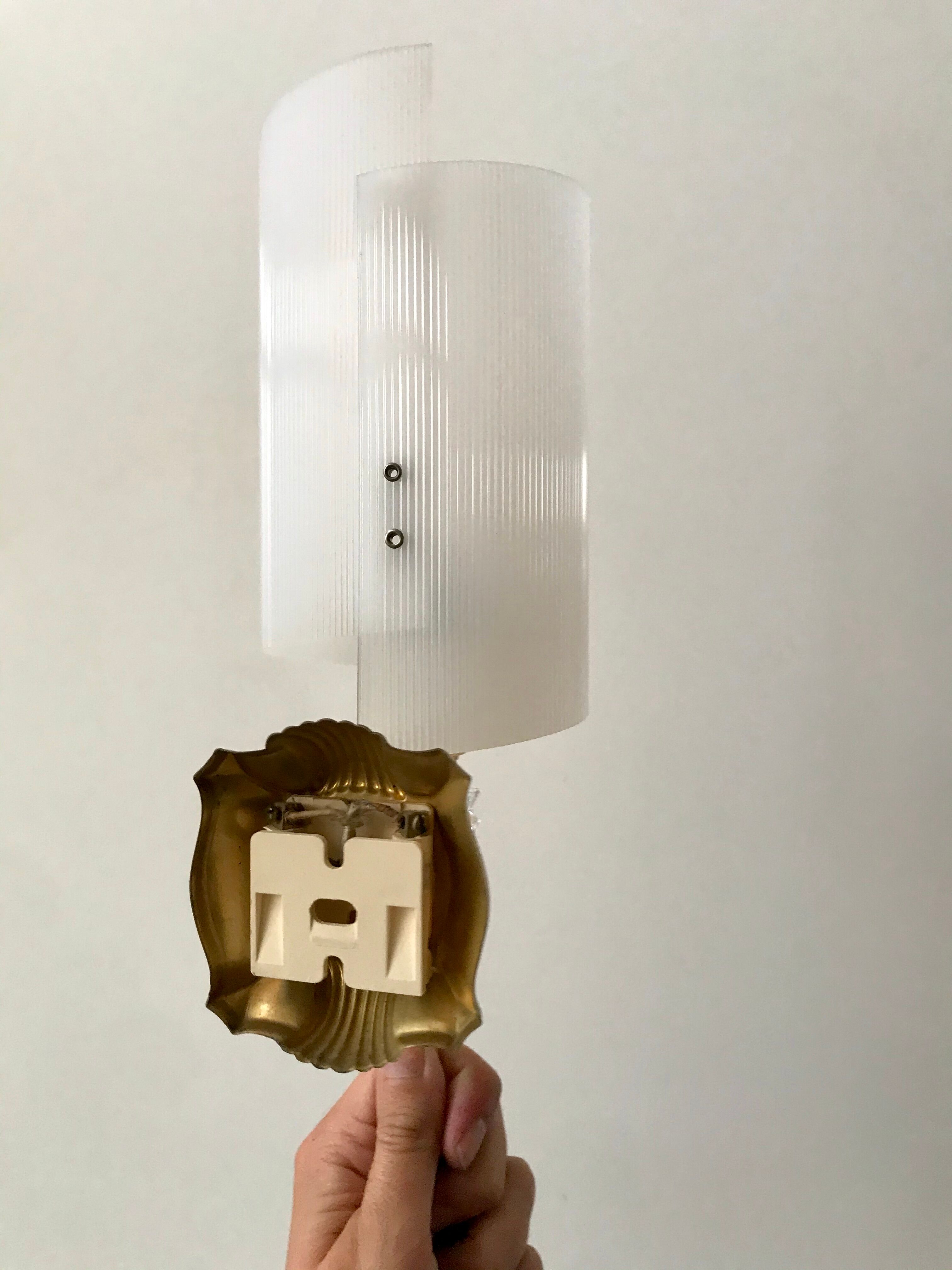 Pair of gold steel wall lamps, plexi and pleated plastic shades 60s-70s