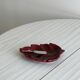 Red ceramic butter dish with knife