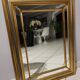 Mirror in gold and silver color