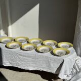 Set of 9 large vintage yellow deep plates with pink flowers and a gold rim.