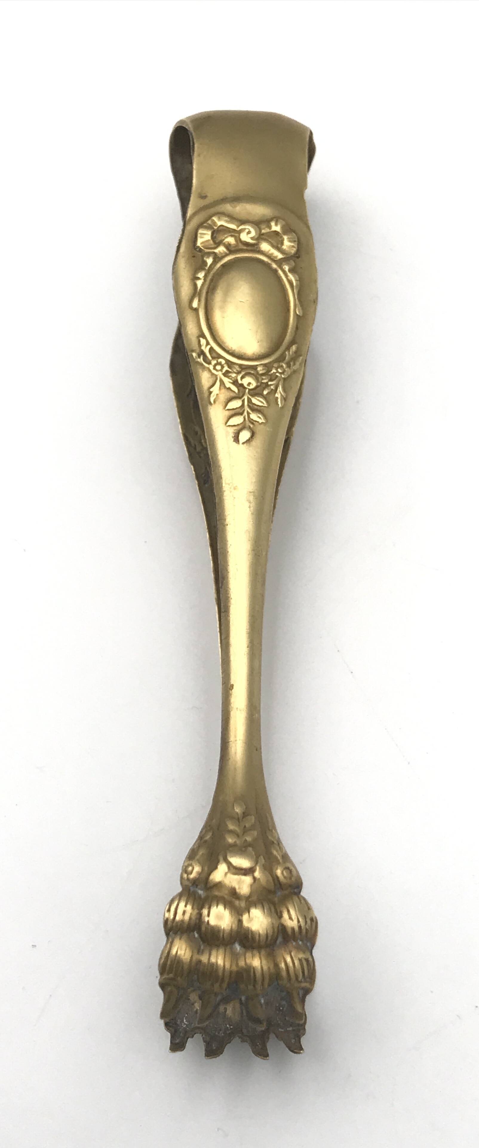 Sugar or ice cube tongs, gold star stamp with lion paw finish